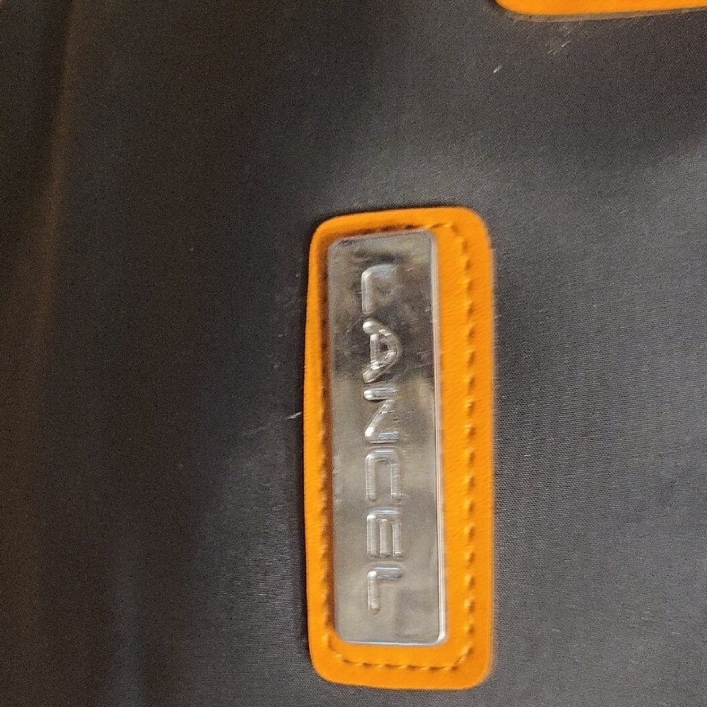Black and Orange Travel Bag with Textured Tag